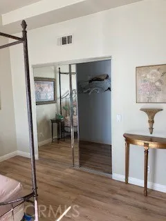 a view of a hallway view with wooden floor and staircase