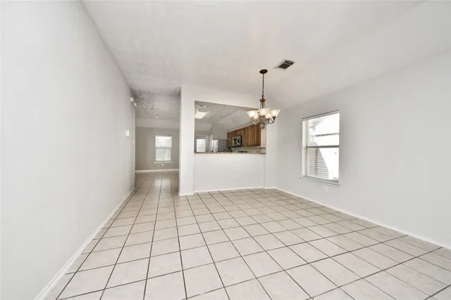 a view of an empty room and window