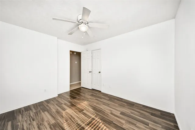 a view of a room with a ceiling fan