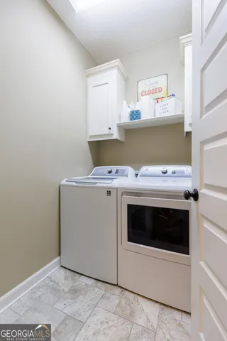 a utility room with washer and dryer