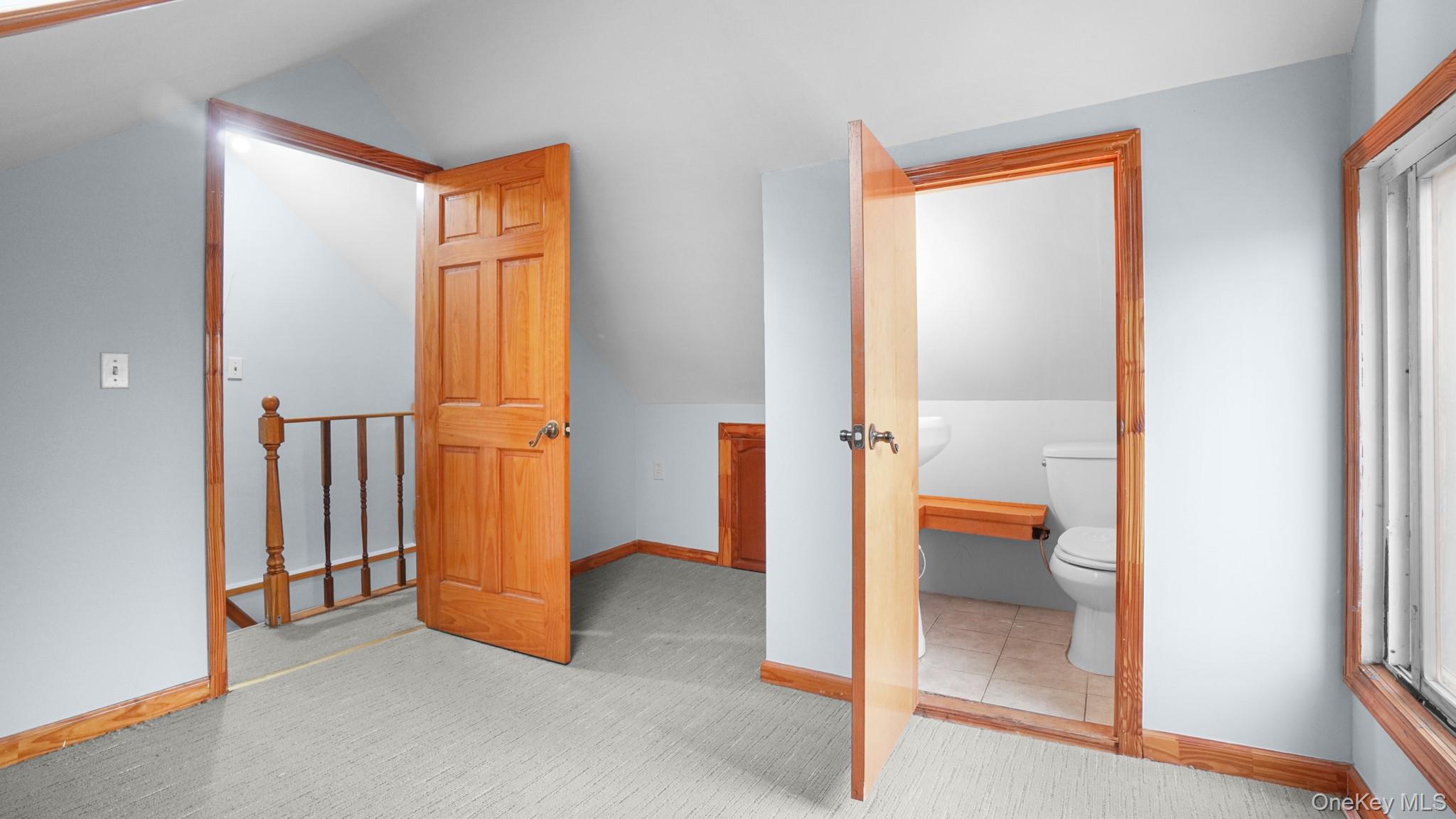 217-34 Hempstead Avenue Queens, NY 11429 - Photo 15 of 21 an empty room and a bathroom with mirror