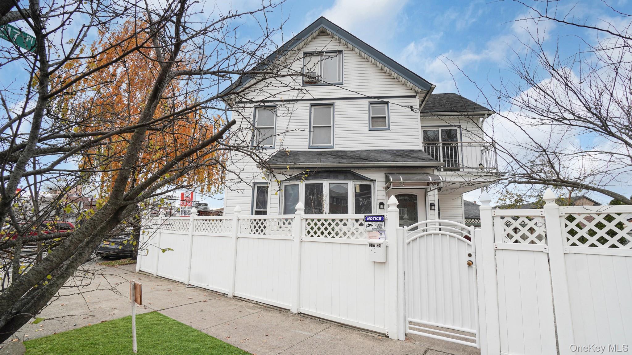 217-34 Hempstead Avenue Queens, NY 11429 - Photo 2 of 21 a front view of a house with white walls