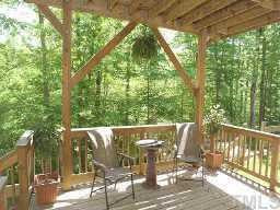 7264 Summit Waters Lane Raleigh, NC 27613 - Photo 9 of 9 Lower deck is very large and can have steps built down to a fenced area, should you have children or pets that need a secured place to play! What a great view of the greenway and very seclued! Other