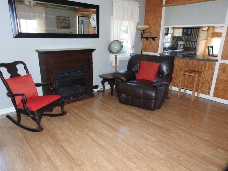 103 Castle Drive Wareham, MA 02576 - Photo 12 of 22 a living room with furniture and a fireplace
