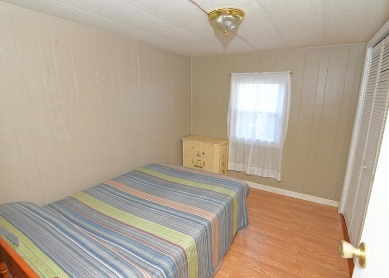 103 Castle Drive Wareham, MA 02576 - Photo 17 of 22 a bedroom with a bed and a window