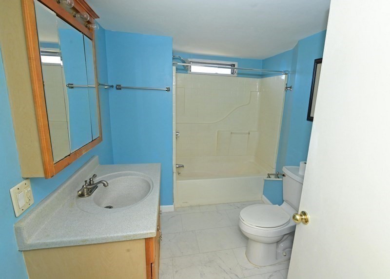103 Castle Drive Wareham, MA 02576 - Photo 20 of 22 a bathroom with a sink a toilet and shower