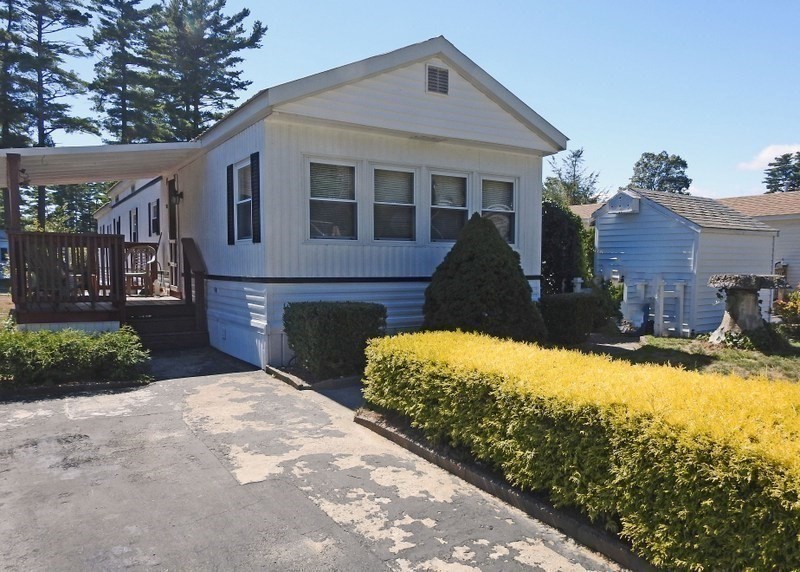 103 Castle Drive Wareham, MA 02576 - Photo 4 of 22 a front view of a house with a yard