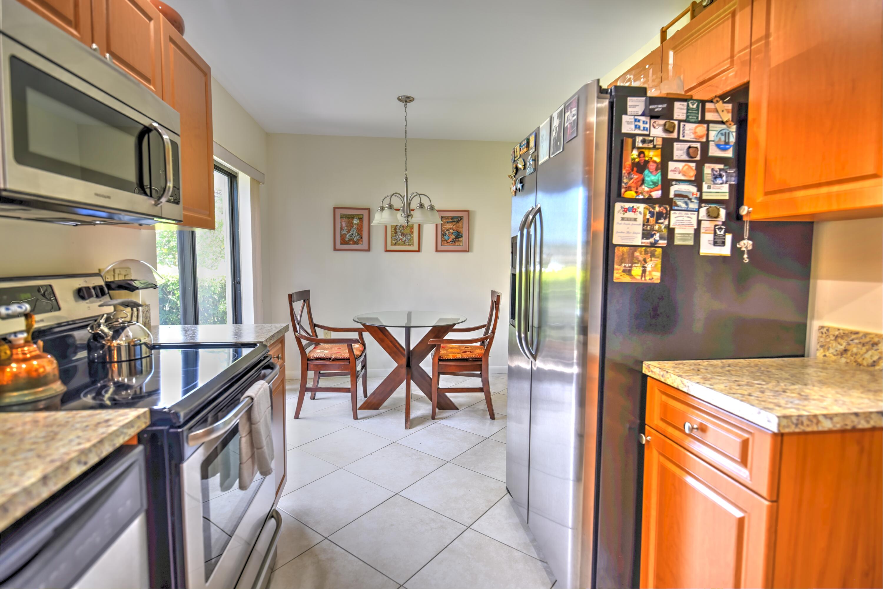 28 Stratford Lane West, Unit C Boynton Beach, FL 33436 - Photo 5 of 25 a view of an outdoor kitchen
