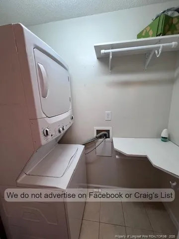 a view of a livingroom with a ceiling fan and window