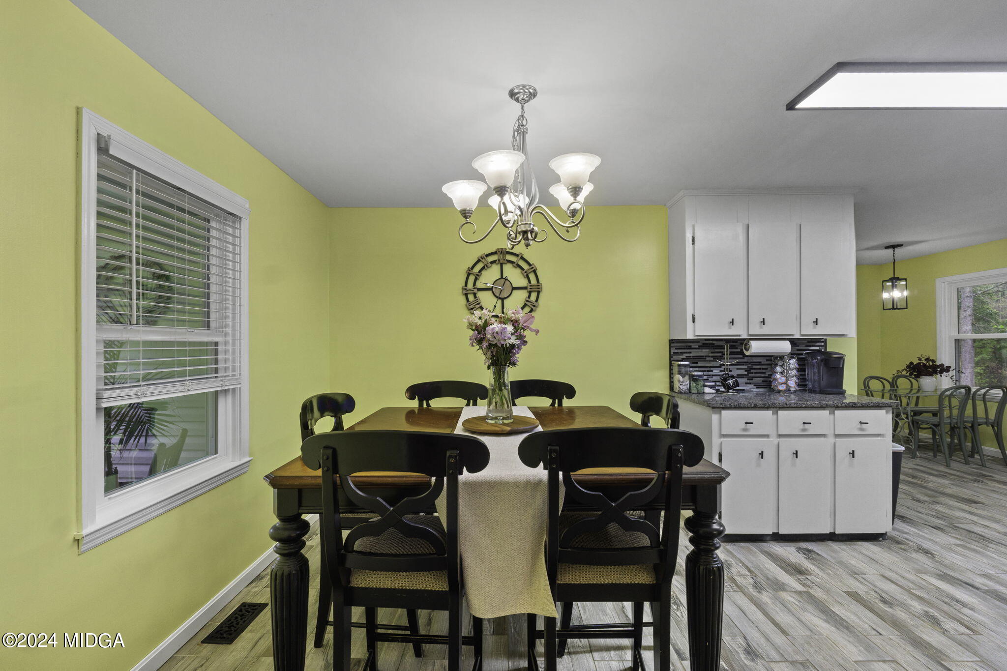 1299 Rainey Road Macon, GA 31220 - Photo 12 of 35 a view of a dining room with furniture and a chandelier