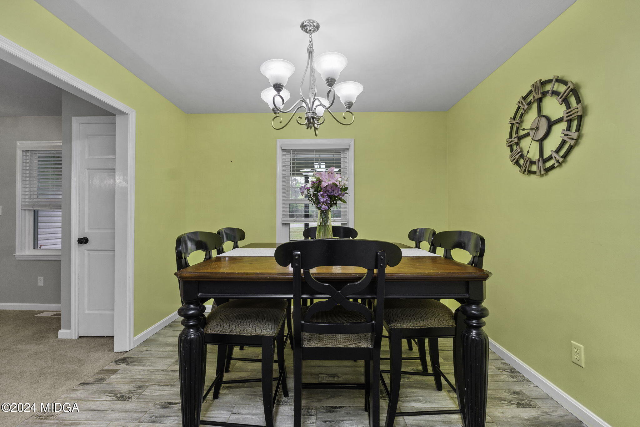 1299 Rainey Road Macon, GA 31220 - Photo 13 of 35 a view of a dining room with furniture and chandelier