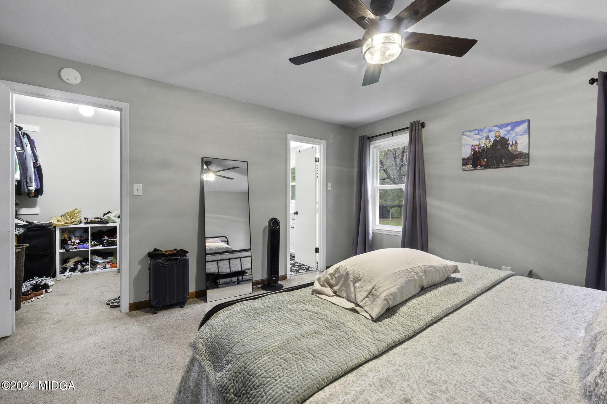 1299 Rainey Road Macon, GA 31220 - Photo 19 of 35 a bedroom with a bed and a chandelier