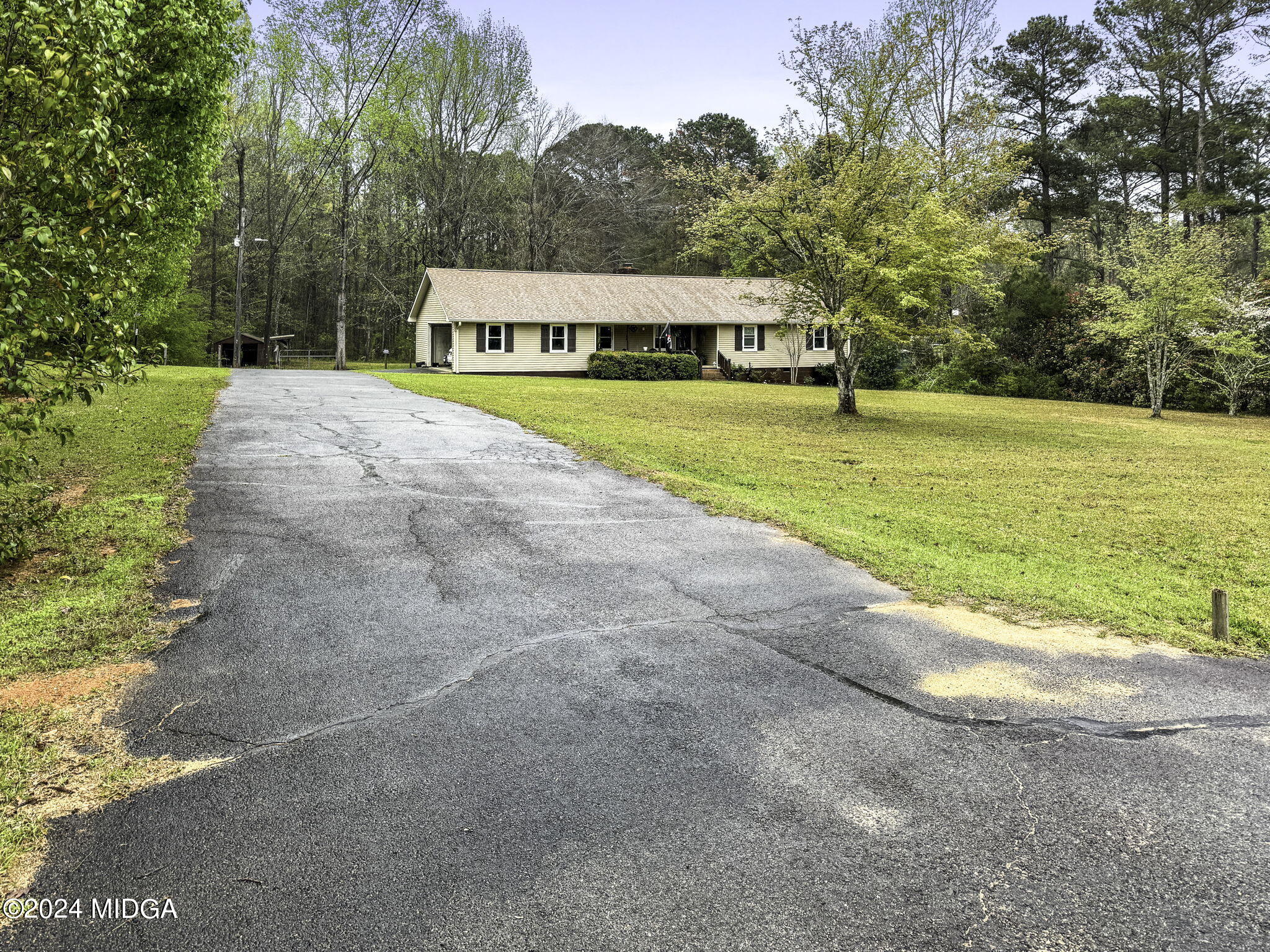 1299 Rainey Road Macon, GA 31220 - Photo 2 of 35 a view of an house with swimming pool and yard