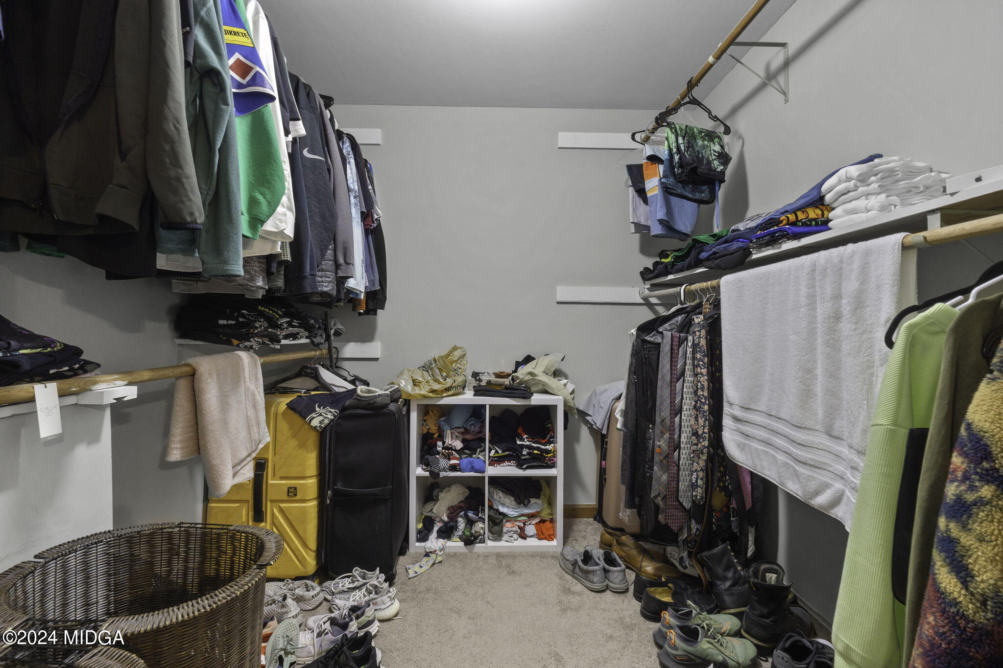 1299 Rainey Road Macon, GA 31220 - Photo 21 of 35 a view of walk in closet with clothes and shoes
