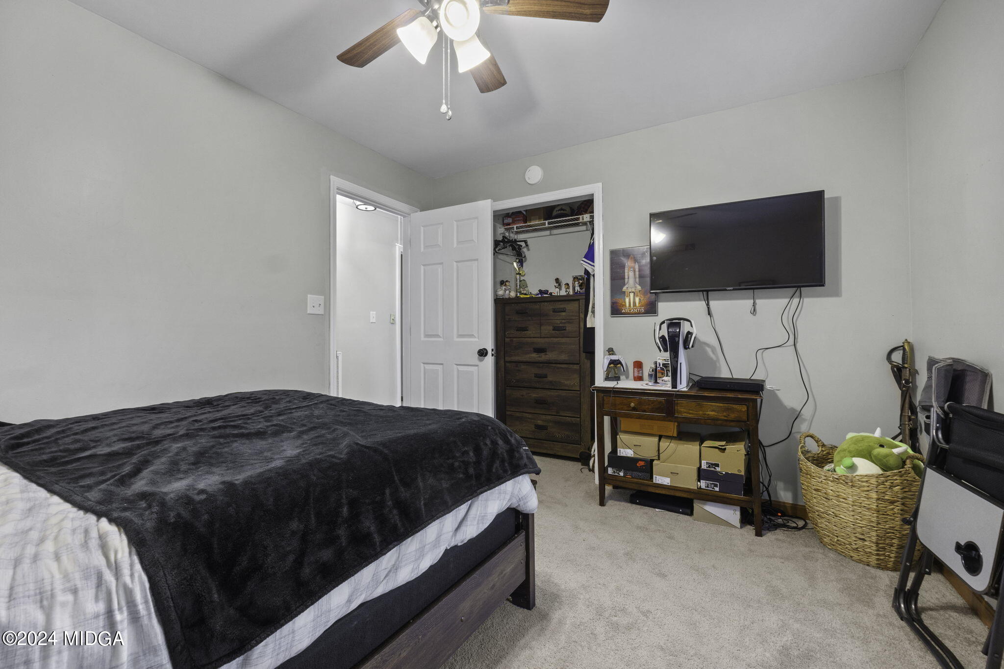 1299 Rainey Road Macon, GA 31220 - Photo 23 of 35 a bedroom with a bed and a flat screen tv