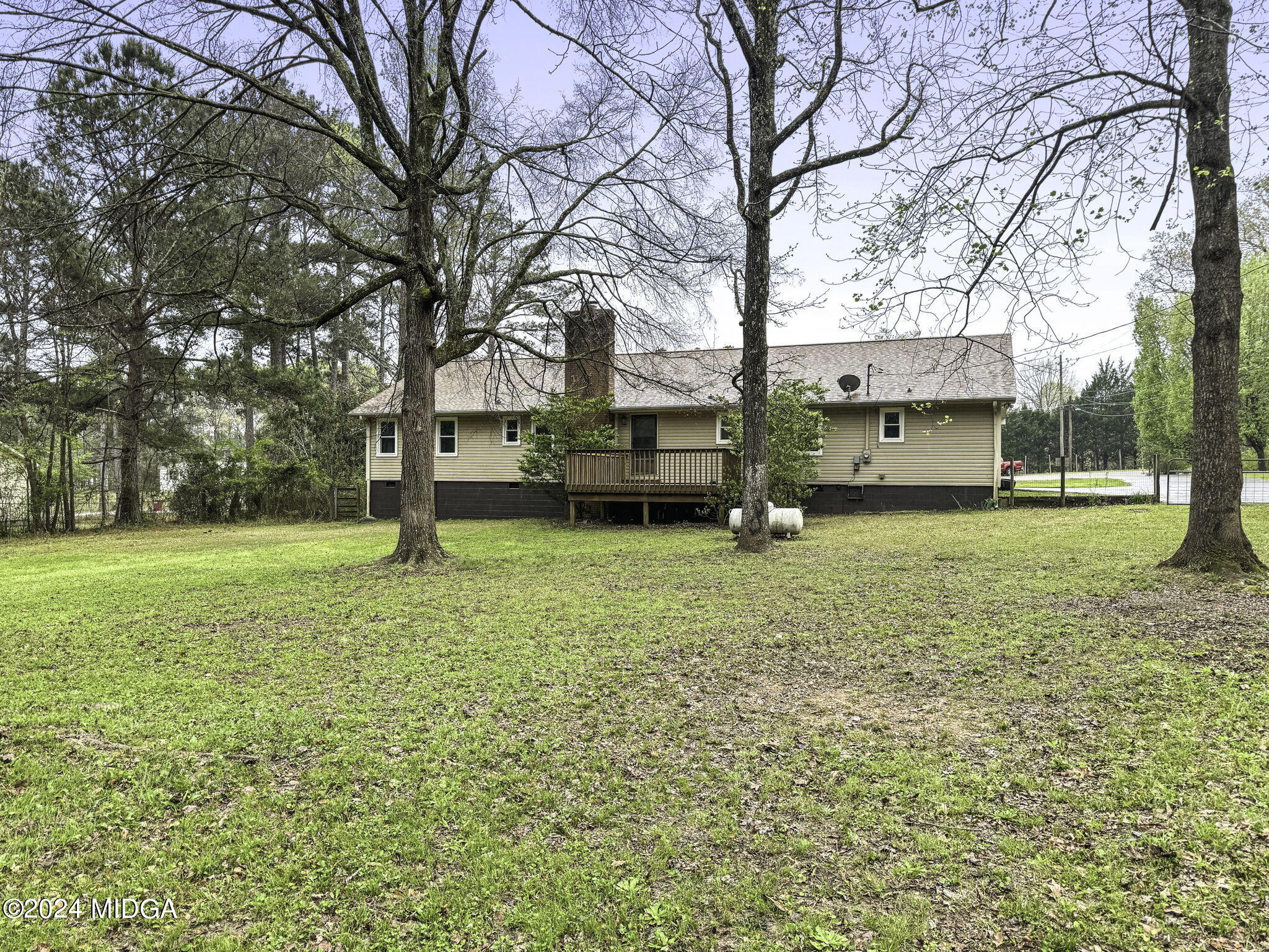 1299 Rainey Road Macon, GA 31220 - Photo 28 of 35 a view of a house with a yard