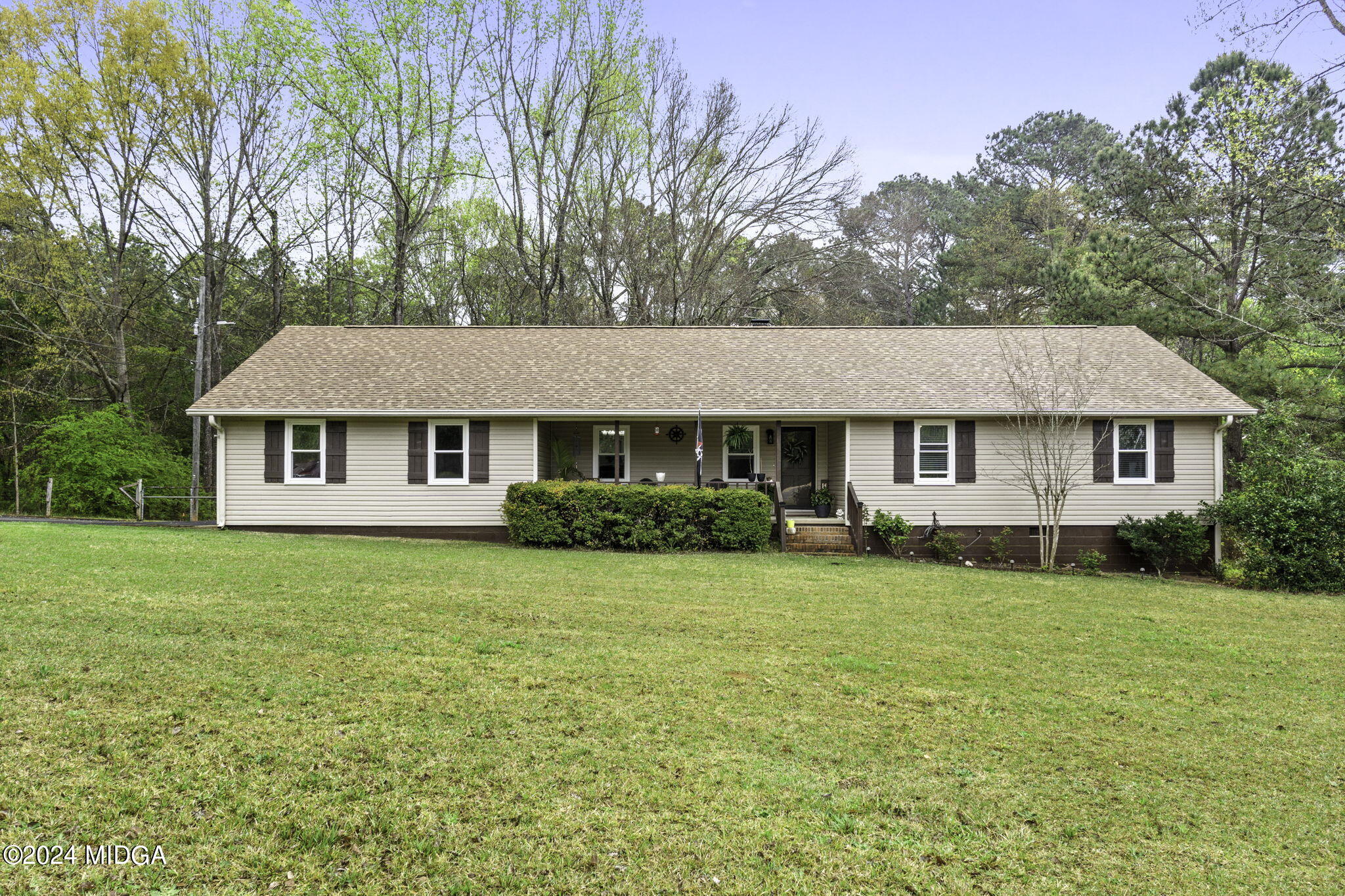 1299 Rainey Road Macon, GA 31220 - Photo 3 of 35 a front view of a house with a garden