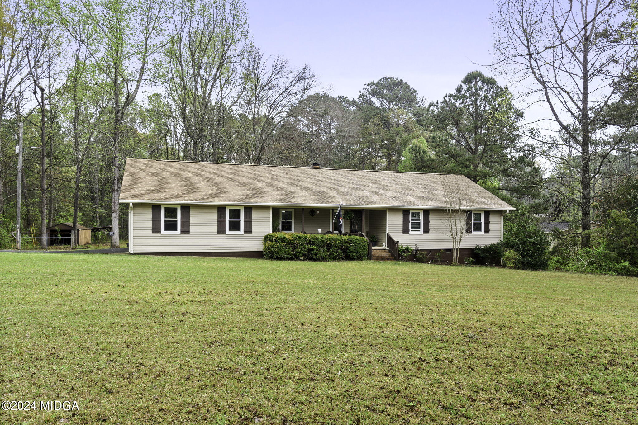 1299 Rainey Road Macon, GA 31220 - Photo 4 of 35 a front view of a house with yard and green space