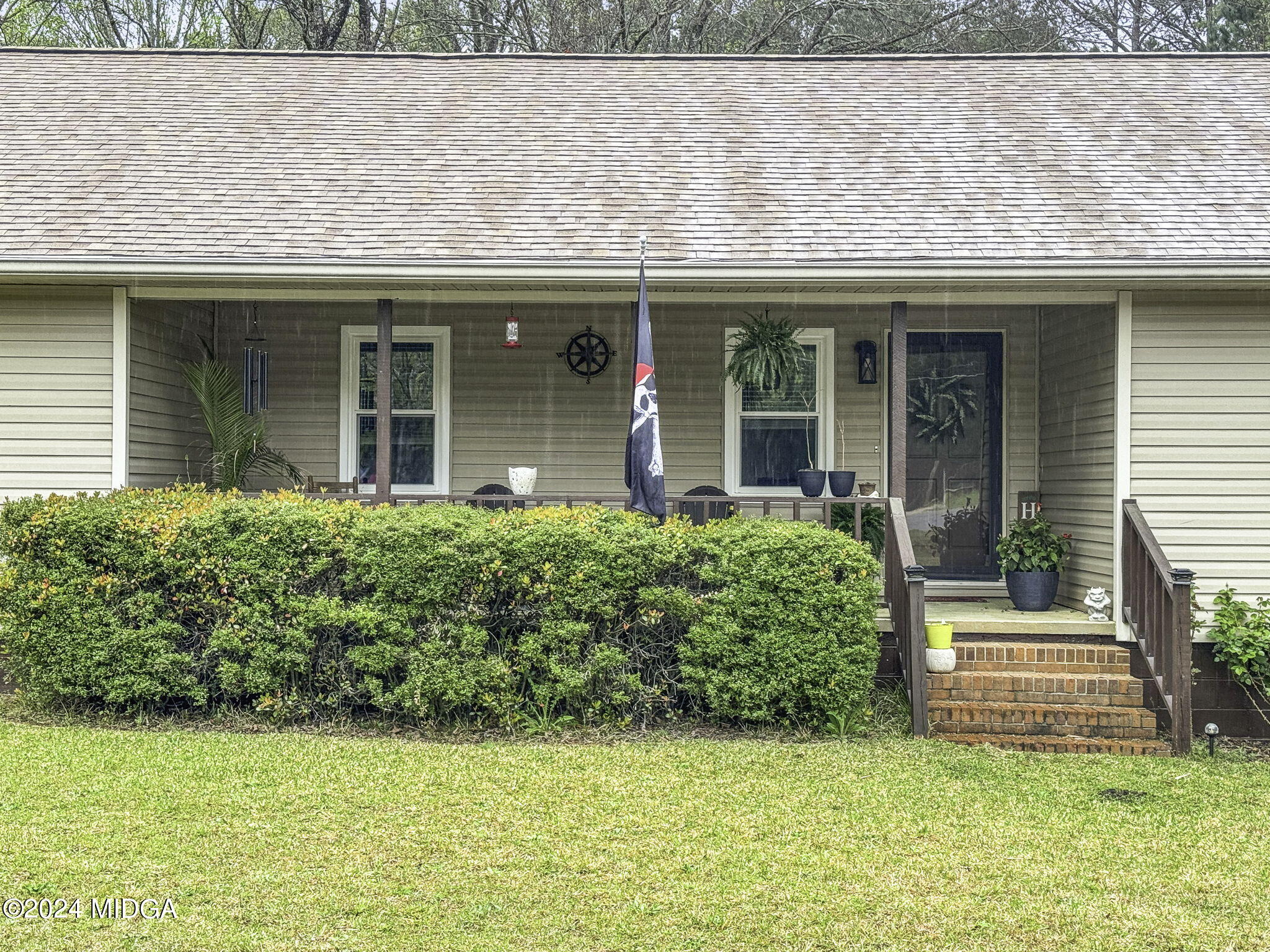 1299 Rainey Road Macon, GA 31220 - Photo 5 of 35 a front view of a house with a yard
