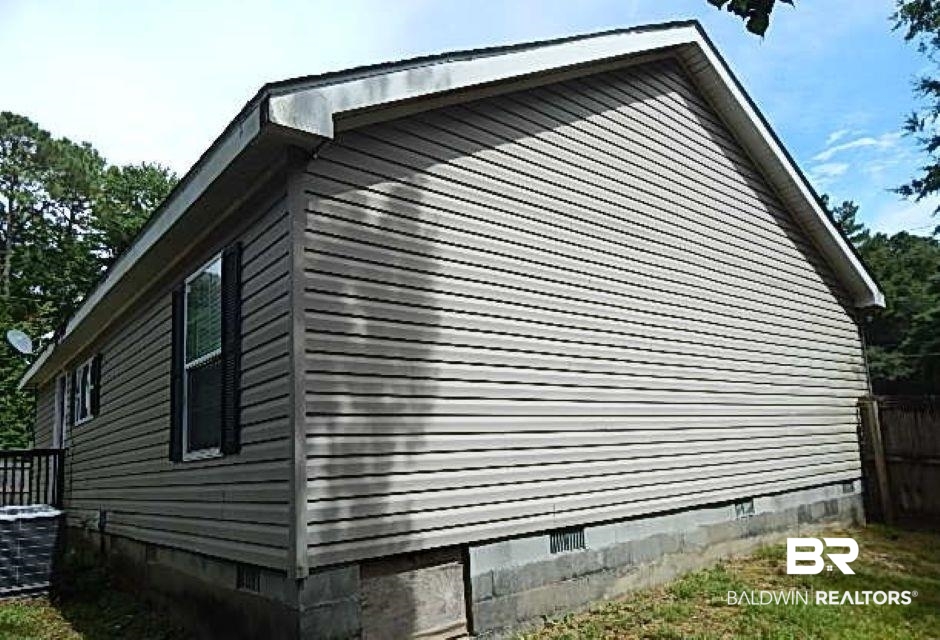 6996 Pinehill Road Daphne, AL 36526 - Photo 4 of 18 View of side of property featuring crawl space