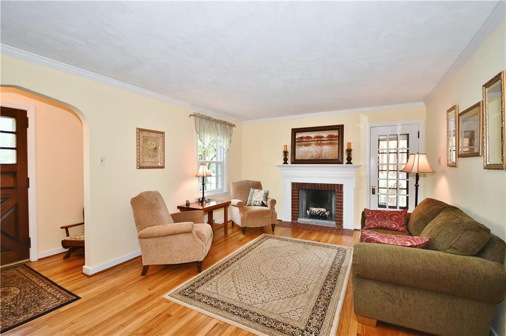 1260 Prospect Road Pittsburgh, PA 15227 - Photo 3 of 25 ...the spacious living room with log burning fireplace on the left side of the house! Notice the door to the side porch.
