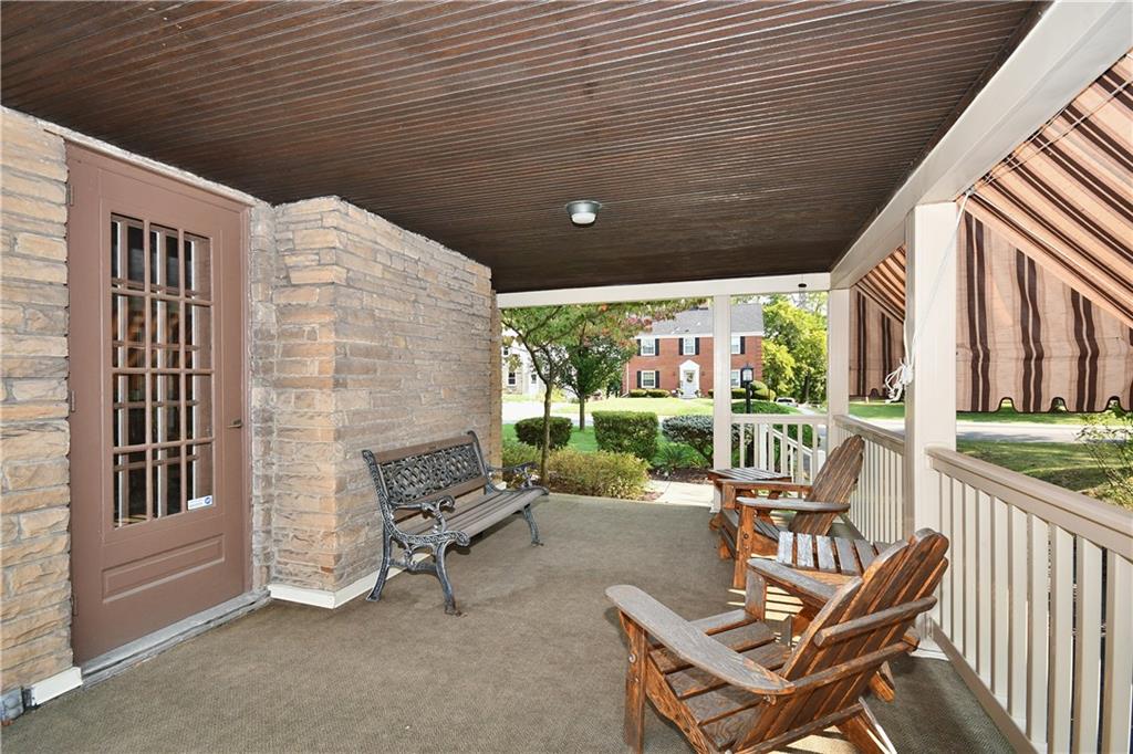 1260 Prospect Road Pittsburgh, PA 15227 - Photo 22 of 25 You will love Summer evenings out on the side porch. This door goes into the living room but there is also an entrance from the family room. The awnings give this area its own 'outdoor room' feel!