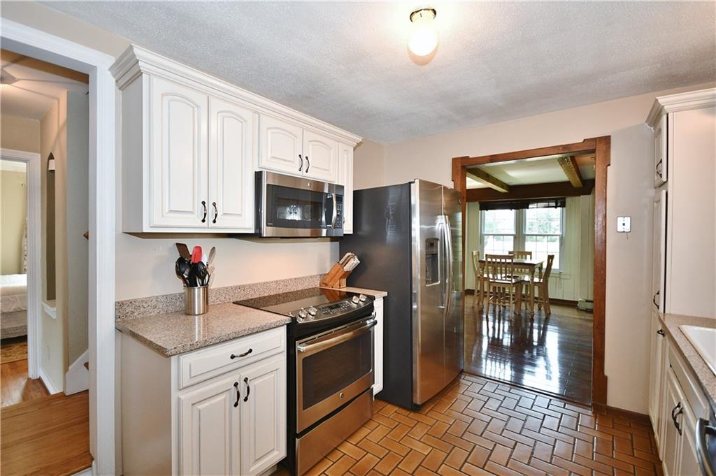 1260 Prospect Road Pittsburgh, PA 15227 - Photo 5 of 25 This photo doesn't do the kitchen cabinetry justice! They are a lovely cream color with a slight glaze. This galley kitchen is sure to make dinner prep a breeze! Appliances all come with.