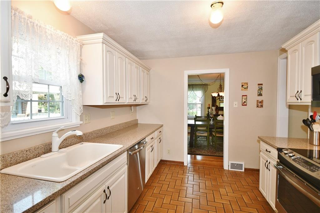 1260 Prospect Road Pittsburgh, PA 15227 - Photo 7 of 25 Here you can see the flow into the dining room. Check out the window over the kitchen sink - there is nothing like looking outside when doing the dishes!