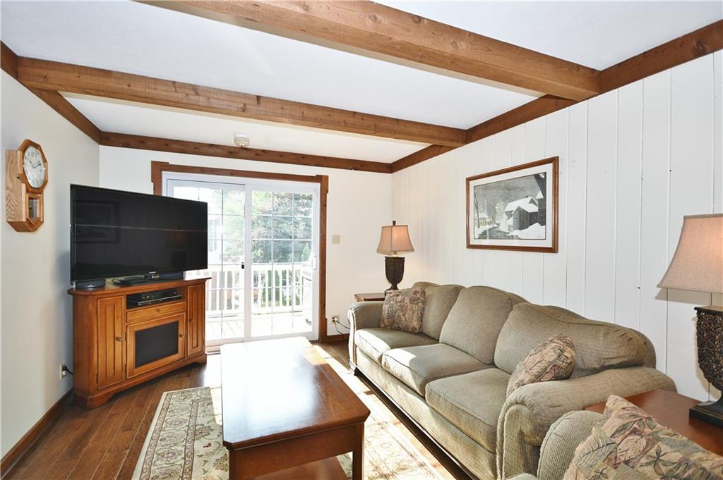 1260 Prospect Road Pittsburgh, PA 15227 - Photo 9 of 25 At one end you have plenty of space for enjoying gamedays, and to go out through the slider to the side deck for grilling!