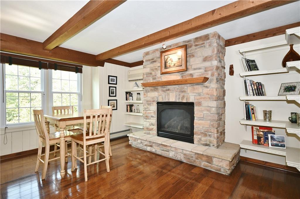 1260 Prospect Road Pittsburgh, PA 15227 - Photo 10 of 25 At the other end you have this cozy gas log fireplace and extra dining area. Such a beautiful hearth to decorate for each season!