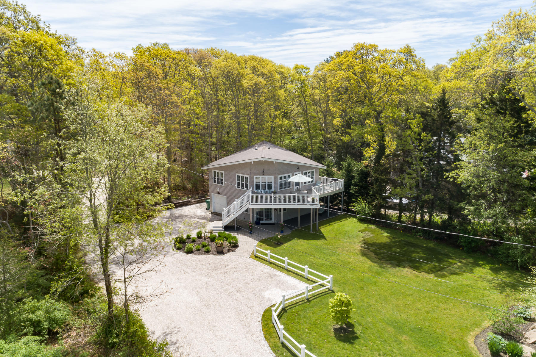 a view of a swimming pool with a patio and a yard