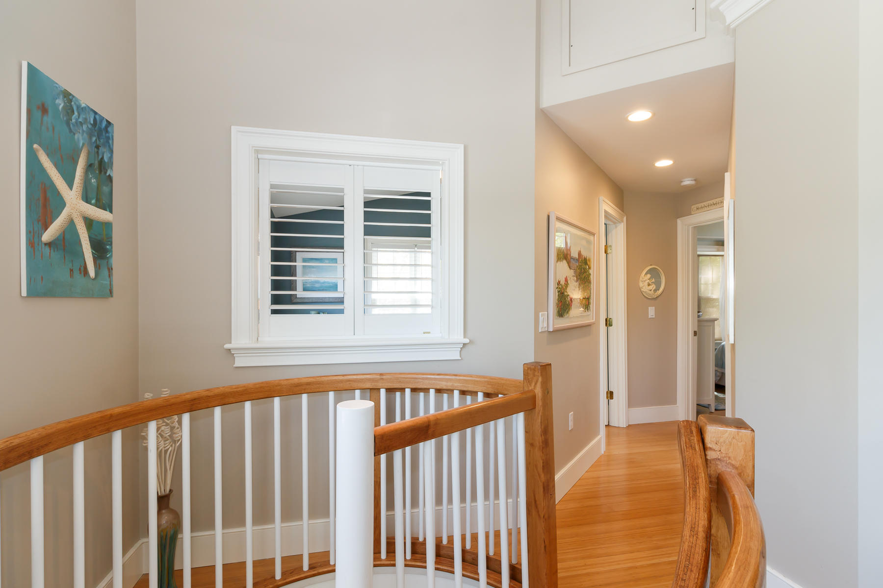 49 Old Shore Road Falmouth, MA 02540 - Photo 17 of 31 a view of a bedroom with wooden floor and windows