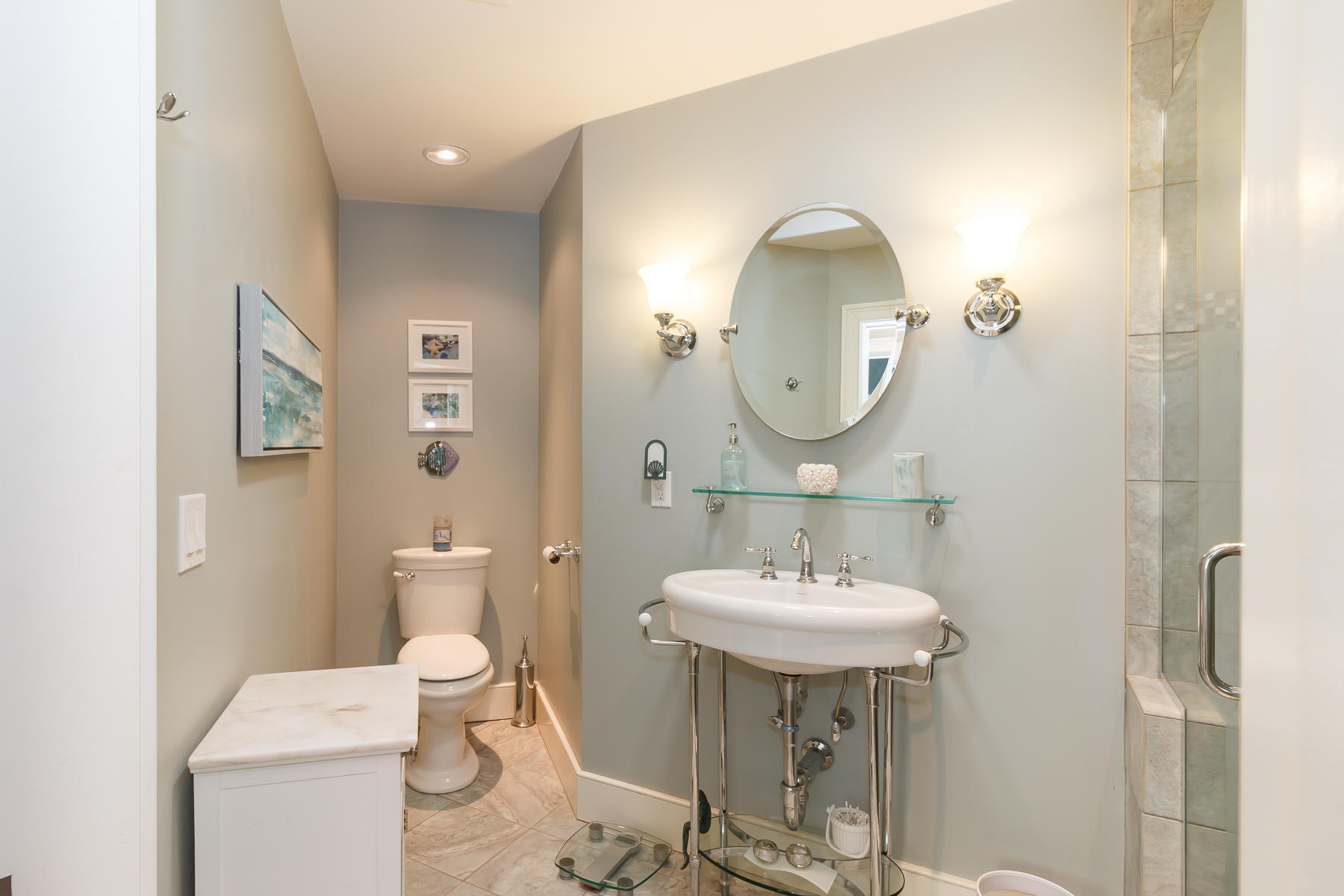 49 Old Shore Road Falmouth, MA 02540 - Photo 20 of 31 a bathroom with a toilet a sink and a mirror