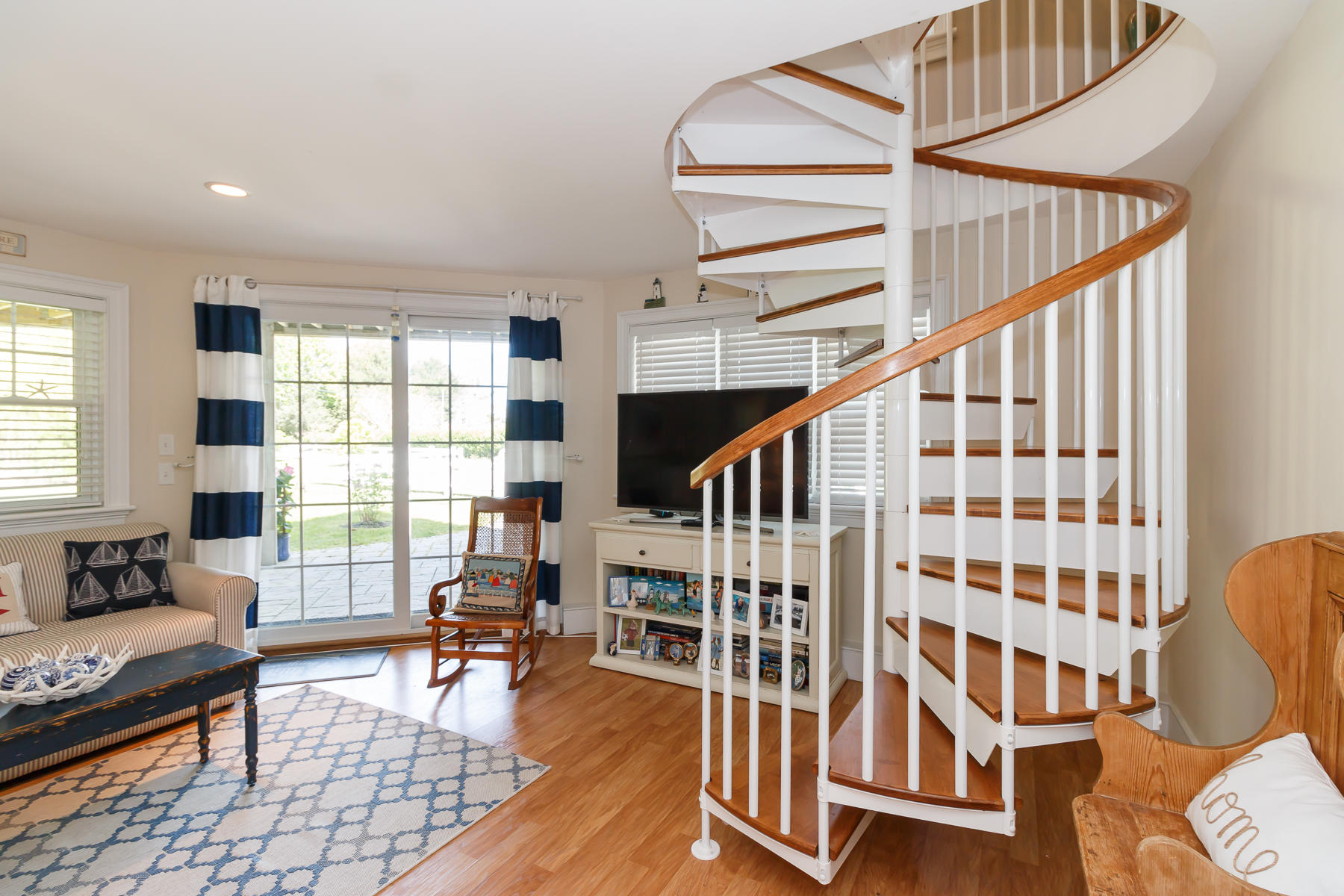 49 Old Shore Road Falmouth, MA 02540 - Photo 22 of 31 a living room with furniture and floor to ceiling windows