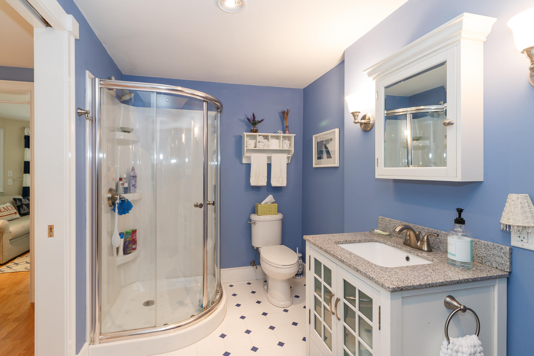 49 Old Shore Road Falmouth, MA 02540 - Photo 26 of 31 a bathroom with a granite countertop sink a toilet and shower