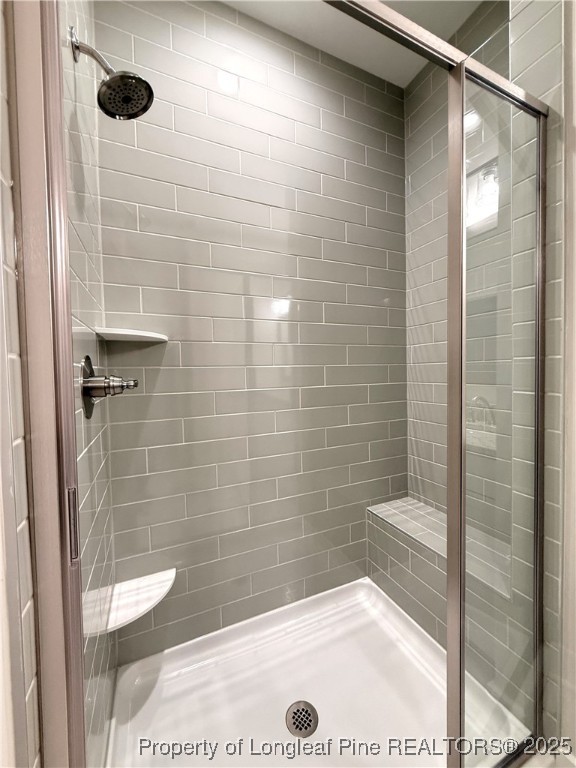 279 Elijah Way Vass, NC 28394 - Photo 25 of 36 a bathroom with a shower and a sink