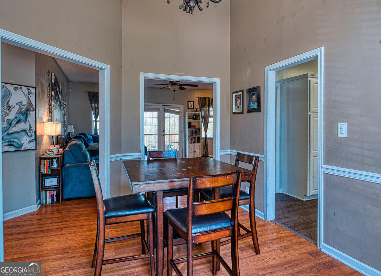 221 Pendleton Court Macon, GA 31216 - Photo 4 of 16 a dining room with furniture and wooden floor