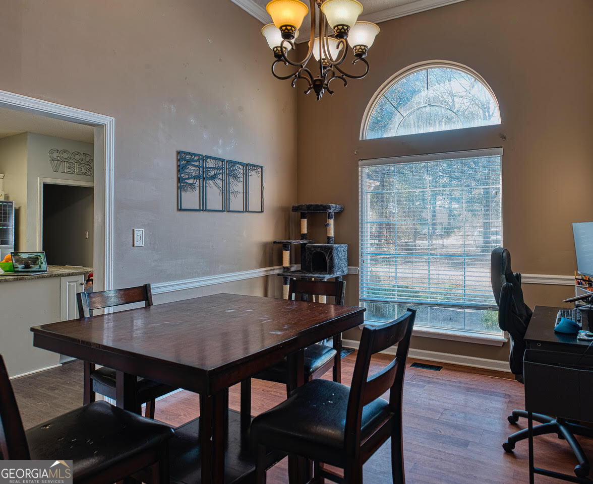 221 Pendleton Court Macon, GA 31216 - Photo 5 of 16 a view of a dining room with furniture window and wooden floor