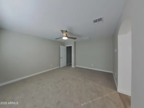 a large kitchen with granite countertop a large counter top stainless steel appliances and a counter top space