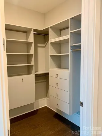 a view of an empty walk in closet