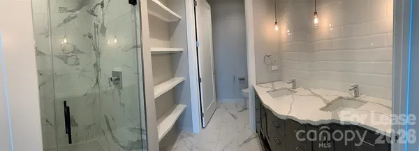 a bathroom with a bathtub and shower