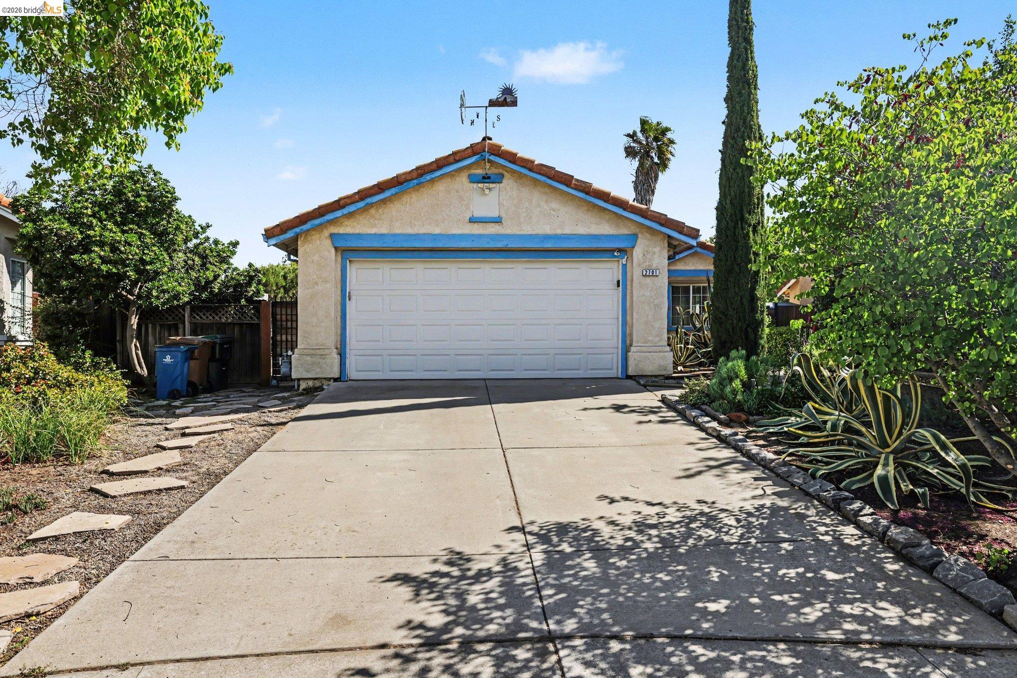 2701 Coffee Tree Way Antioch, CA 94509 - Photo 2 of 29 a front view of a house with a yard and garage