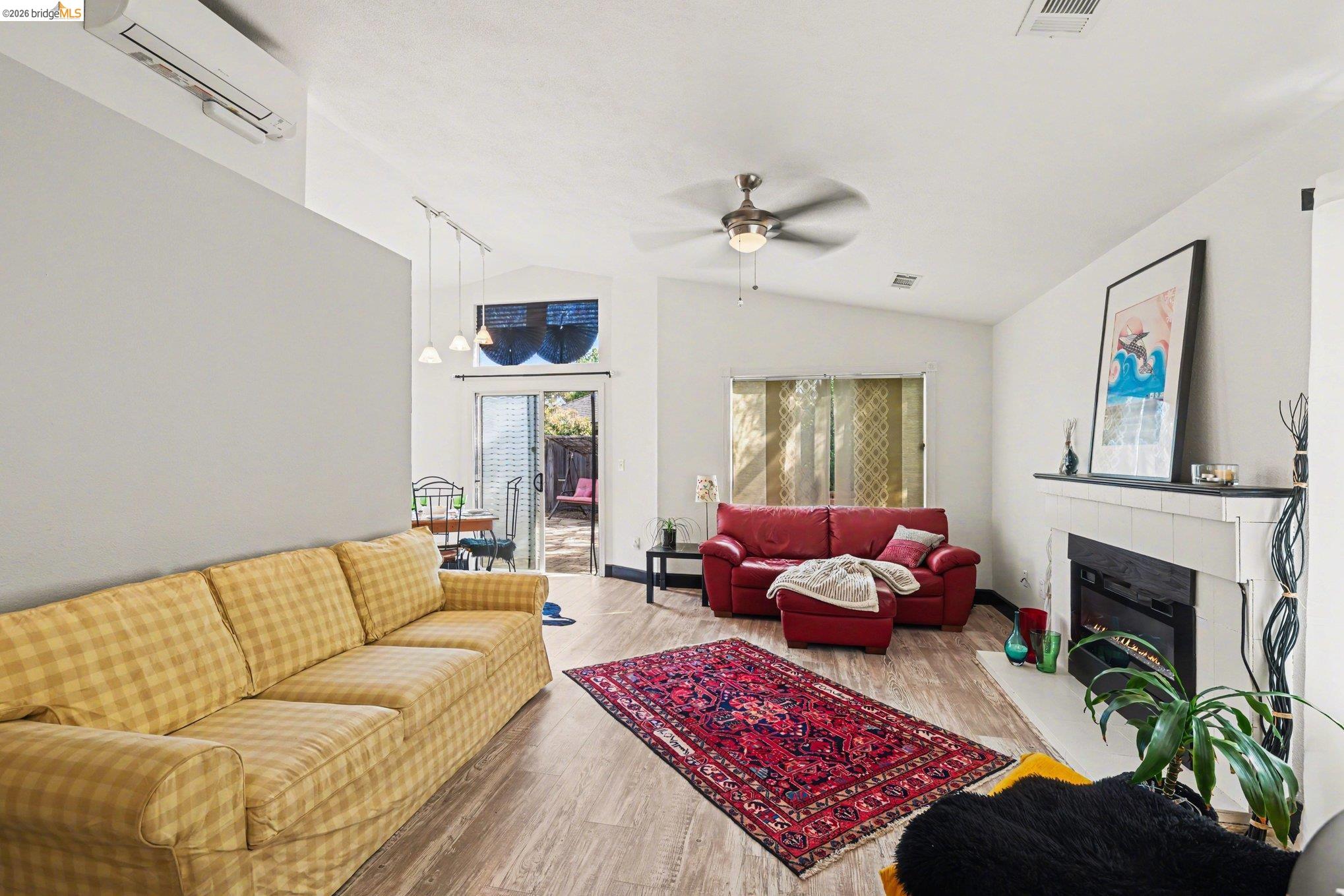 2701 Coffee Tree Way Antioch, CA 94509 - Photo 4 of 29 a living room with furniture a fireplace and a table