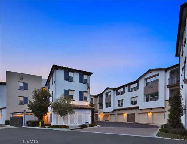 a backyard of a house with outdoor seating