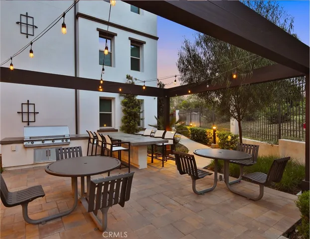 an empty room with wooden floor and ceiling fan