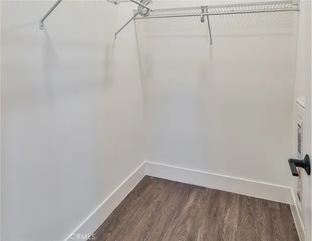 a view of kitchen with sink and wooden floor