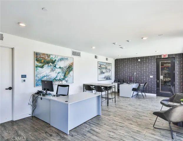 a lobby with furniture and floor to ceiling window