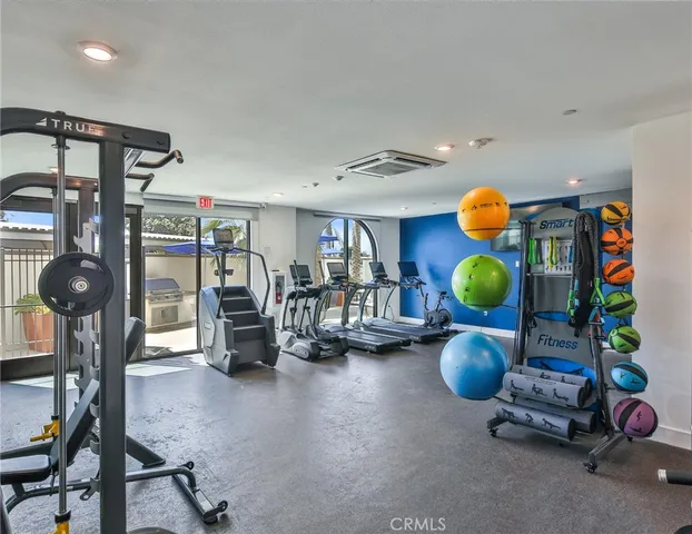 a front view of a building with a garden