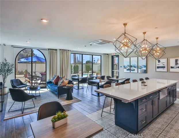 a swimming pool with outdoor seating and yard