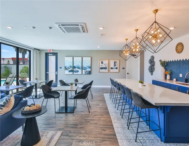 a view of a table and chairs under an umbrella in patio